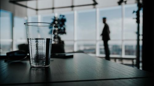 Close-up of glass window on table
