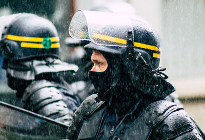 Midsection of man with umbrella during winter