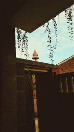 Low angle view of roof against sky