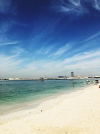 Scenic view of beach against blue sky