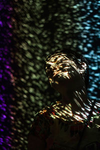 Woman looking away while enjoying at nightclub