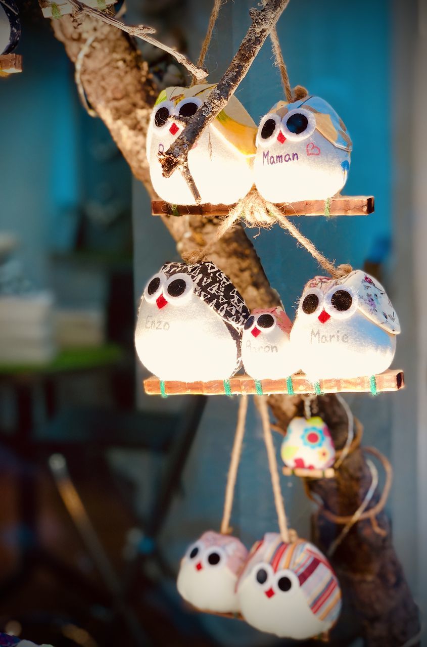 CLOSE-UP OF STUFFED TOY HANGING AT SHOP