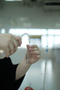 Close-up of woman hand holding cigarette