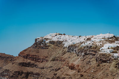 Low angle view of fort against clear blue sky