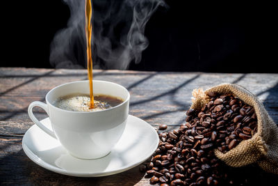 Close-up of coffee cup on table