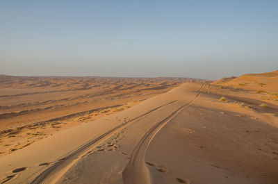 Scenic view of desert against clear sky