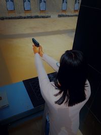 High angle view of woman using mobile phone