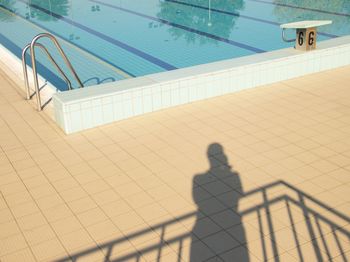 Low angle view of man standing on wall