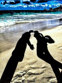 Shadow of people on beach