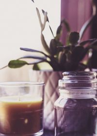 Airtight with potted plant and candle at home