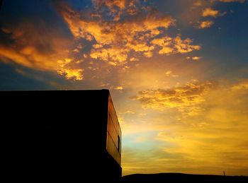 Low angle view of cloudy sky at sunset