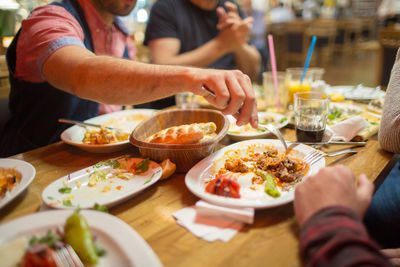 Middle eastern men enjoying a traditional iftar dinner. selective focus