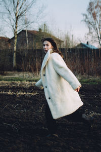 Woman looking at camera on field