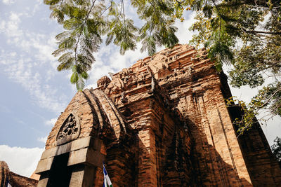Low angle view of historic temple against sky