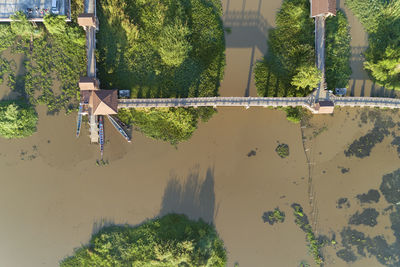 Aerial view of bridge over river during sunny day