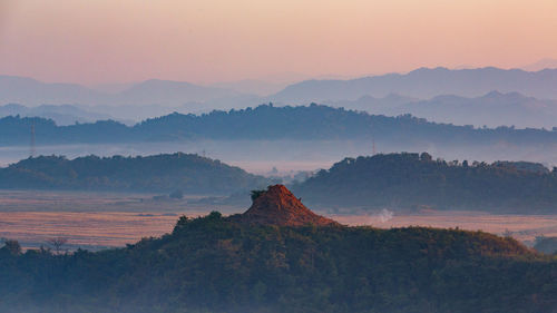 Scenic view of mountains against dramatic sky