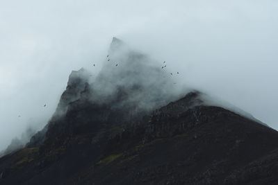 Scenic view of mountains against sky during winter