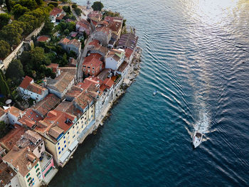 High angle view of townscape by sea