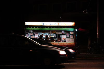 Cars on road in city at night