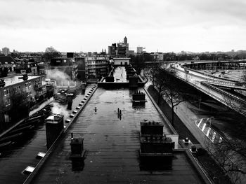 High angle view of bridge over river in city against sky