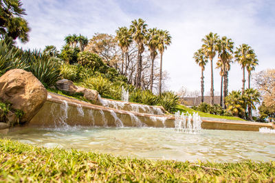 Scenic view of waterfall against sky