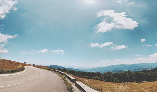 Road amidst landscape against sky