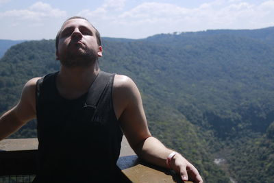 Young man looking at mountains