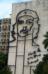 Low angle view of statue against building