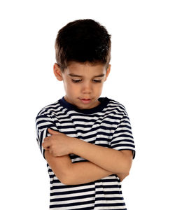 Cute boy standing against white background