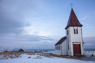 White building against sky during winter