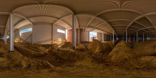 Seamless spherical 360 degree panorama in equirectangular projection of indoor construction site.