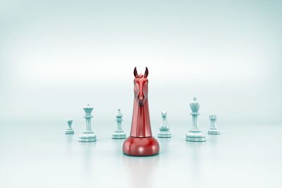 Close-up of chess board against white background