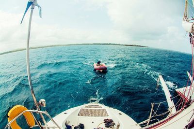 People enjoying boat in sea