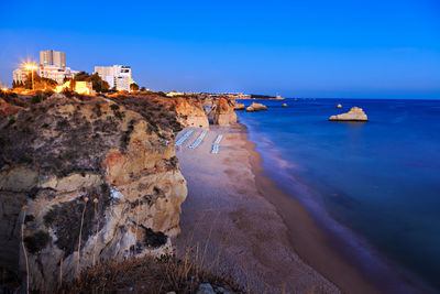 Panoramic view of sea and buildings against sky