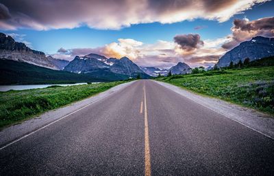 Empty road along countryside landscape