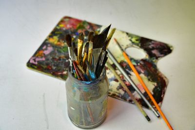 High angle view of various paintbrushes on table