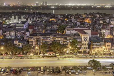 High angle view of illuminated city buildings at night