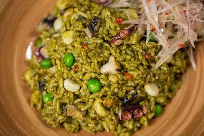 High angle view of rice and vegetables in bowl on table