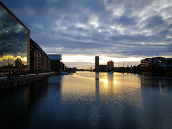 Buildings in city at sunset