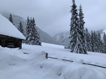 Scenic view of snow covered mountains against sky