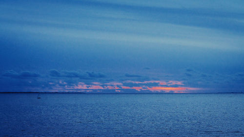 Scenic view of sea against sky at sunset