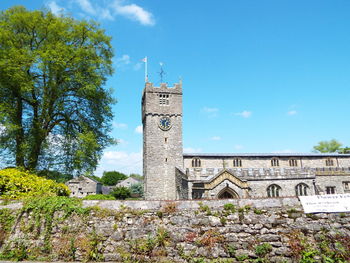 Low angle view of built structure against blue sky