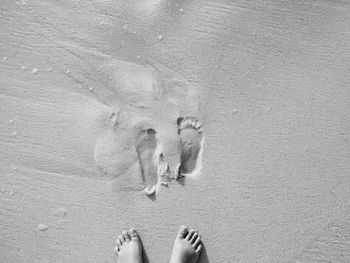 Close-up of footprint on sand