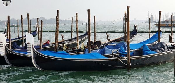 Boats moored in canal