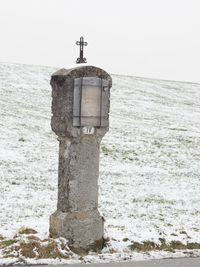 Built structure on beach against clear sky