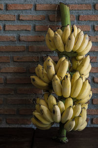 Close-up of fruits against wall