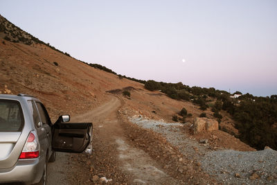 Car on road against clear sky