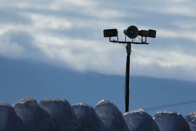 Street light against sky