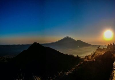 Scenic view of mountains at sunset