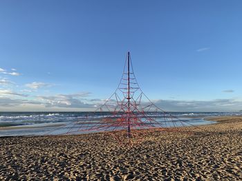 Scenic view of beach against blue sky